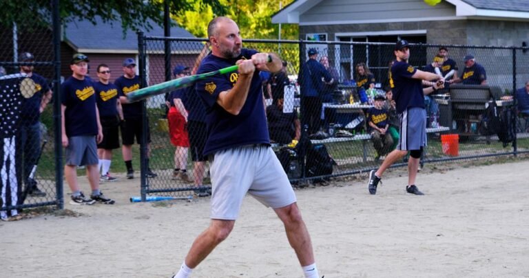 Police and fire fighters battle on the softball field